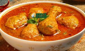 Foto chicken Chettinad khas India dengan ayam berkuah pedas dan rempah segar disajikan hangat