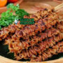 Tusuk Sate Usus khas Yogyakarta dengan usus ayam kecokelatan, bumbu kecap manis pedas, tampak gurih kenyal menggugah selera