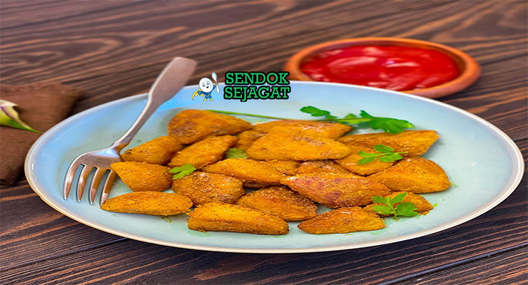 Tumpukan Viazi Karai khas Tanzania yang renyah keemasan, tampak gurih dengan lapisan tepung berbumbu, siap disantap