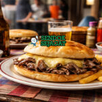 Sandwich Barros Luco khas Chili dengan daging sapi juicy dan keju cheddar meleleh di atas roti Prancis renyah, sajian hangat siap makan