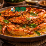 Kari Kepiting khas Jawa Timur dengan kepiting segar empuk, kuah santan kental kuning, tampak gurih hangat menggugah selera
