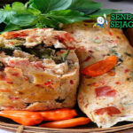 Pepes Tahu Udang khas Jawa Barat dibungkus daun pisang, tahu dan udang dengan kemangi segar, tampak gurih harum menggugah selera