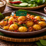 Sambal goreng telur puyuh khas Jawa Tengah dengan telur puyuh kecil berbalut sambal merah pedas manis, disajikan hangat di piring bersama nasi putih