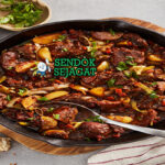 Wild Boar Stew khas Australia dengan daging babi hutan empuk, tomat bush earthy, wortel bawang kental, tampak gurih hangat menggugah selera