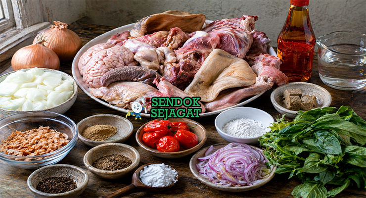 Bahan-bahan lengkap resep isi ewu khas Nigeria termasuk kepala kambing, minyak kelapa sawit merah, potash, ehuru, cabai habanero, dan daun utazi