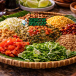 Laphet thoke khas Myanmar dengan daun teh fermentasi dicampur kacang goreng, bawang goreng, tomat, dan kubis, disajikan segar di mangkuk