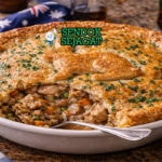 Irisan Macleay Valley Rabbit Pie Australia autentik dengan crust pastry flaky keemasan, isian daging kelinci gurih beraroma thyme dan bacon di piring putih yang menggugah selera